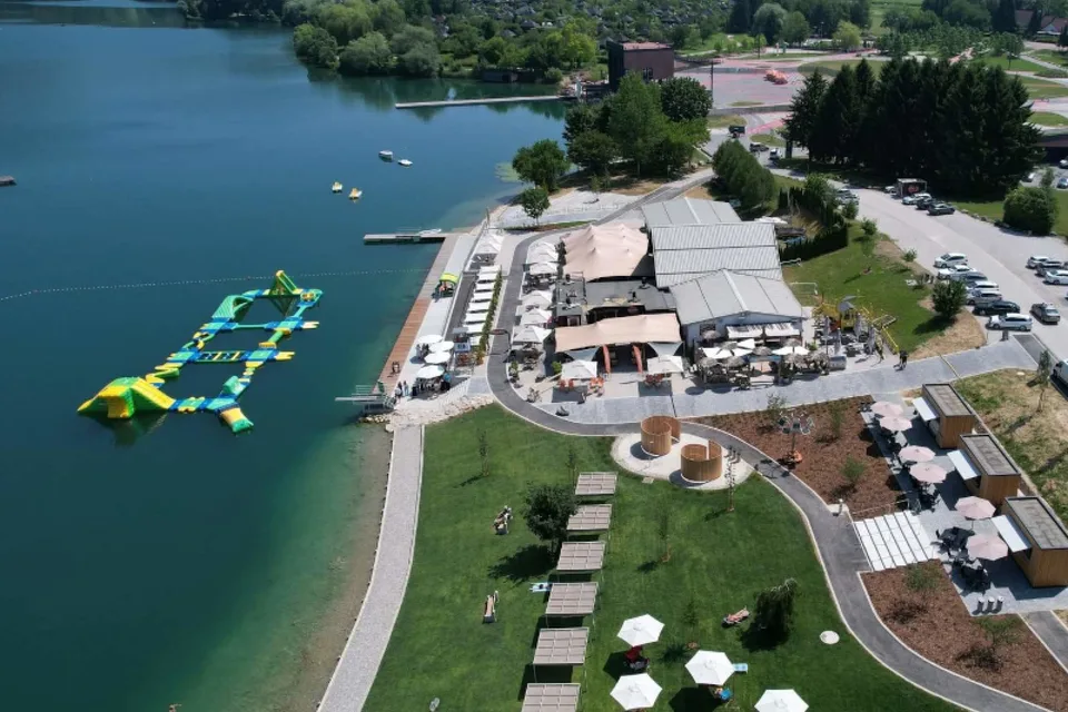 Velenje Beach, water park and the green shore of Lake Velenje
